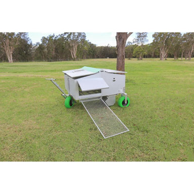 chicken caravan 30 in a grass pasture front view